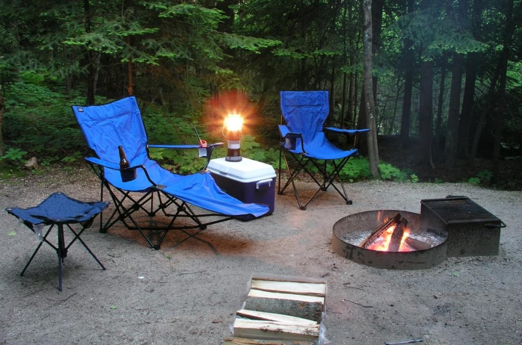 Best Camping Chair - Range of camping chairs: stool, recliner and chair, in a front country campsite