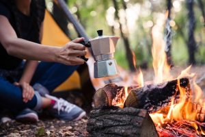 Coffee Pot Over Campfire in front of tent