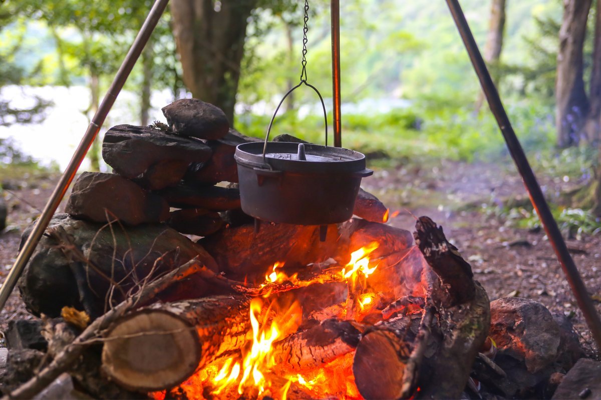 Collapsible iron tripod for cooking over campfire