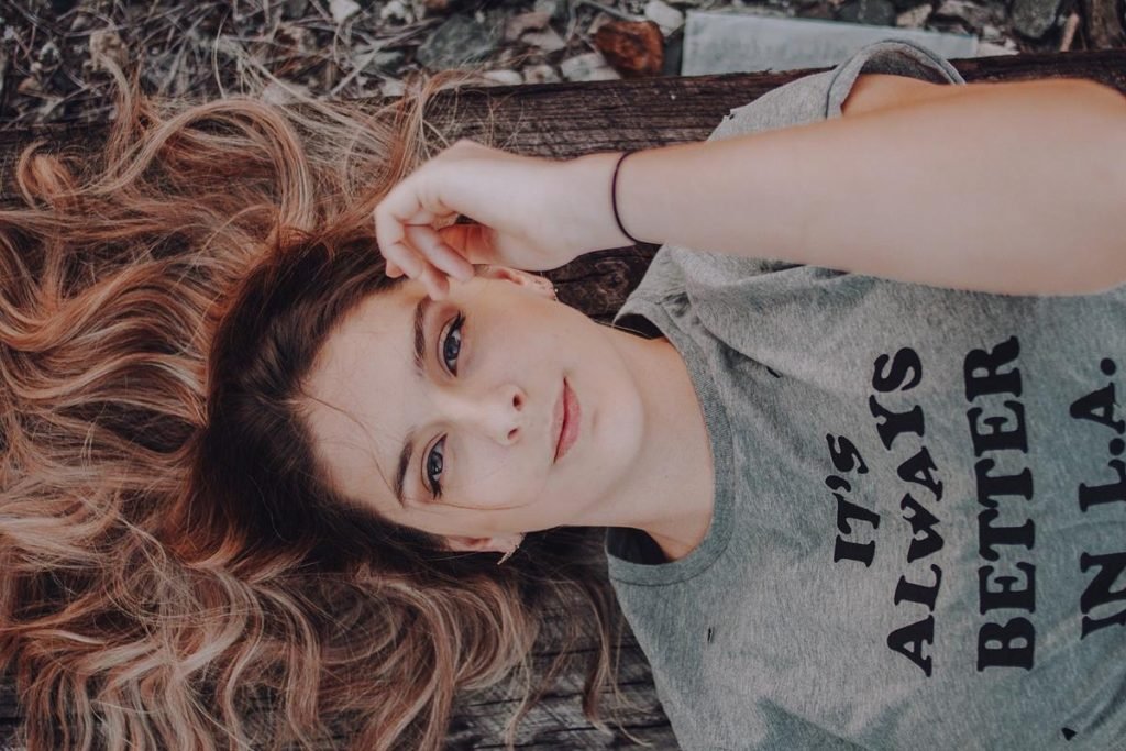 girl with long hair lying down